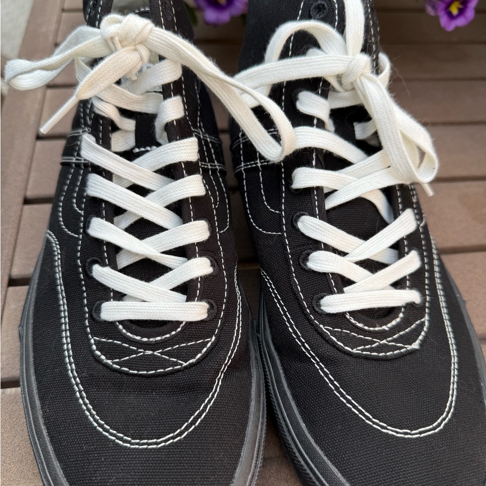 Vans black canvas with white stitching skateboard shoes